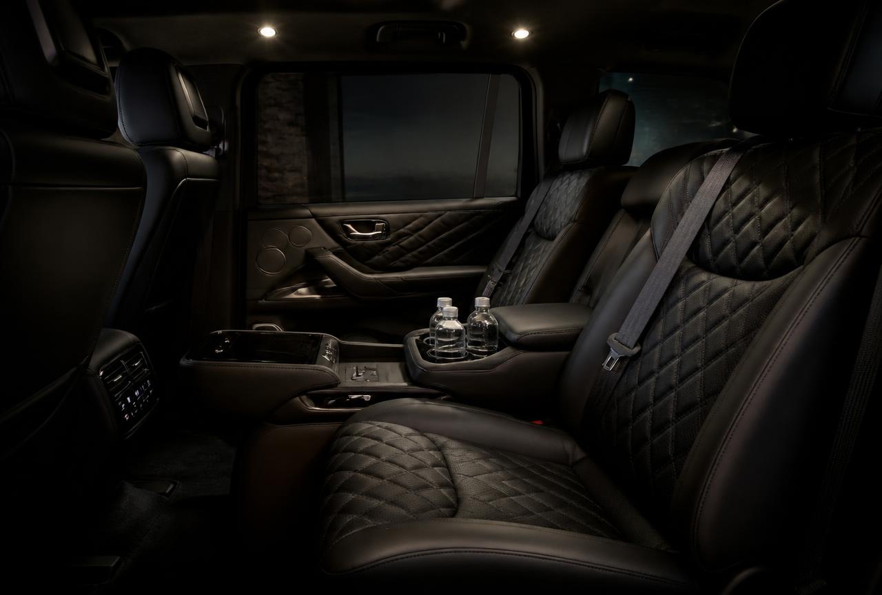 Interior cabin of a premium black SUV with quilted leather seating